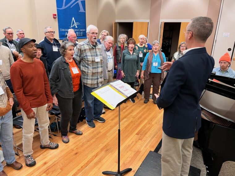 The Asheville Senior Chorus singing together with proper breathing.