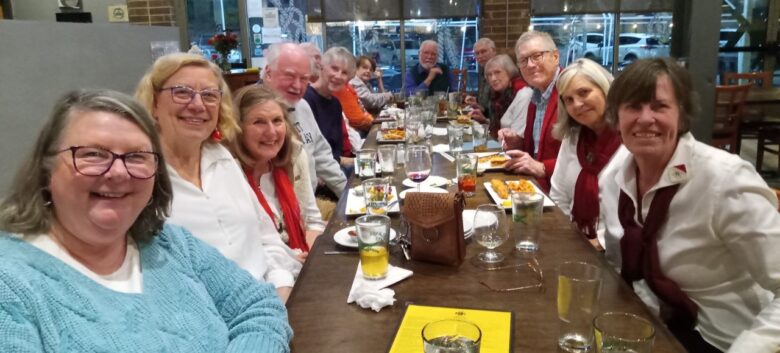 An image of some Asheville Senior Chorus members having a meeting.