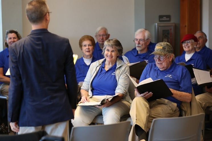 Asheville Senior Chorus members singing during a Monday evening rehearsal at the Mannheimer Room, Reuter Center, OLLI at UNC Asheville.